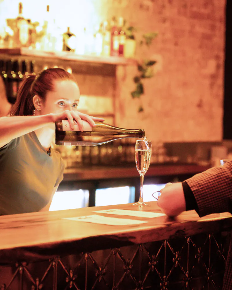 Bartender pouring sparkling wine