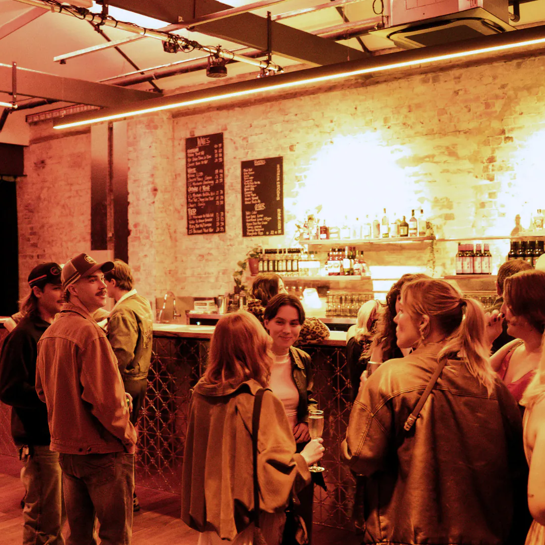 Guests mingling at the bar